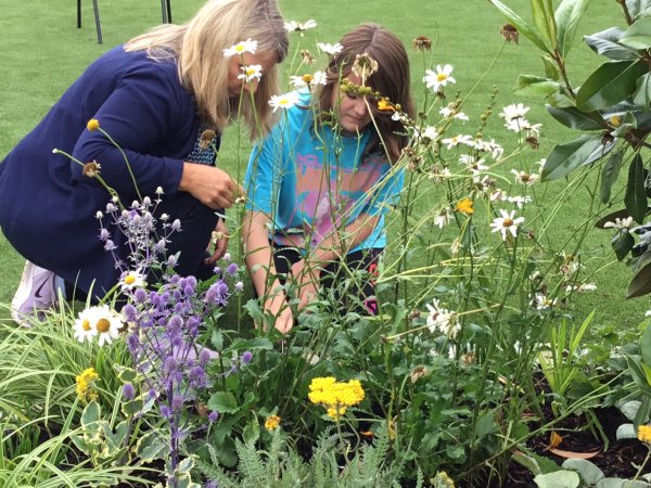 Vanessa and Wendy tending to the flowers in the Sensory Garden. 